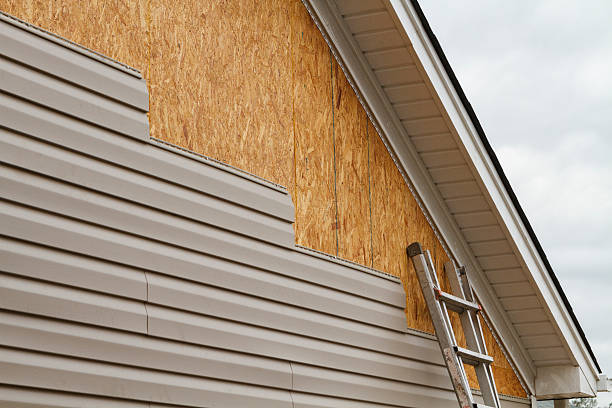 Professional Siding Installation technician working in Sayville, NY